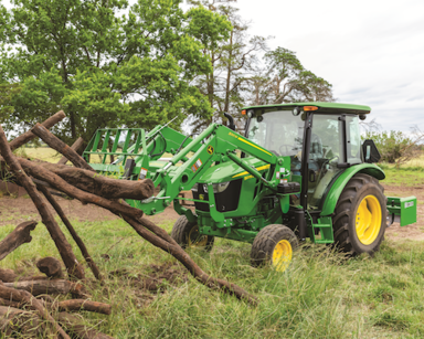 A 5075E Utility Tractor collecting logs